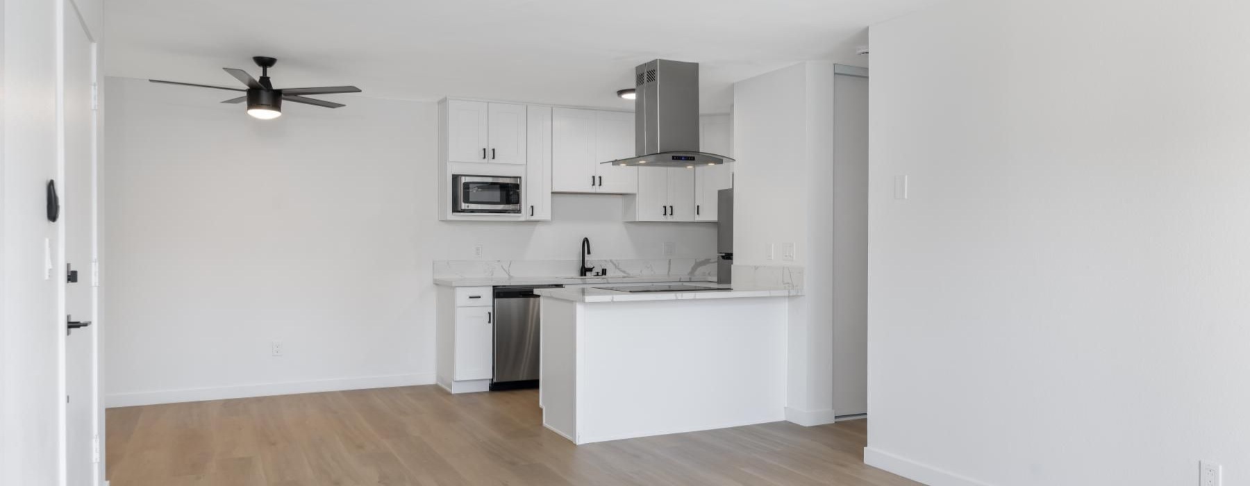 a kitchen with white cabinets