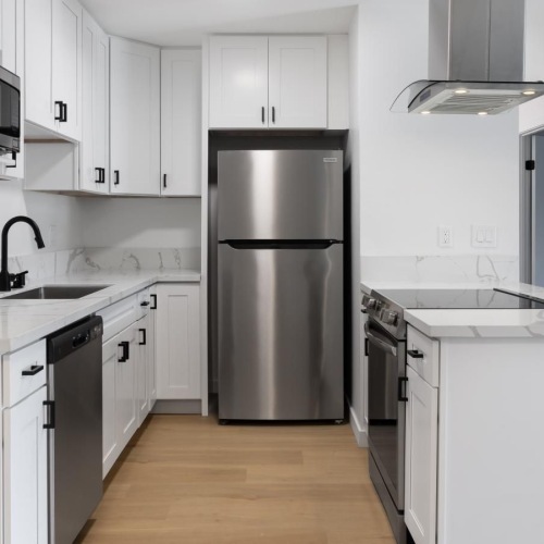 a kitchen with white cabinets
